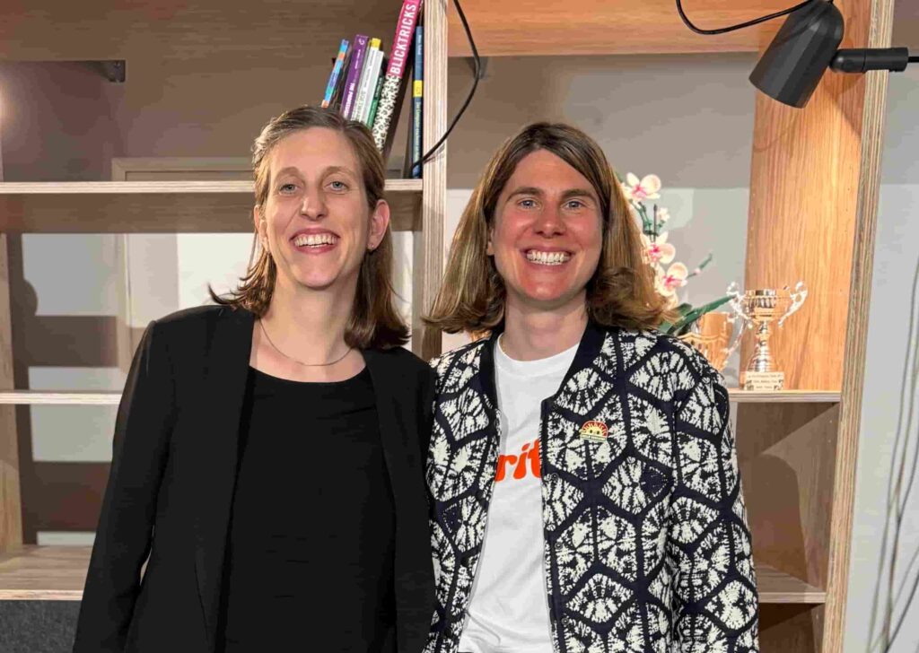 isaline and corina in front of book shelf at liip agency zurich